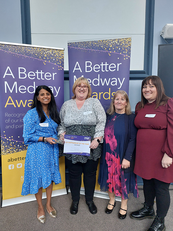 Members of the surgery receiving the award